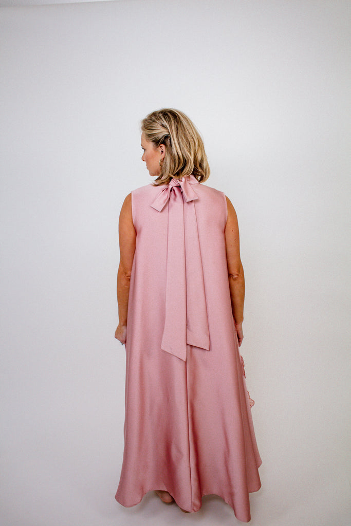 blush pink A-line gown with intricate floral embellishments and a high neckline