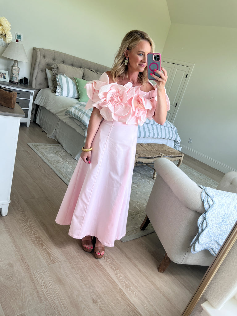 Blush Dress with rosette straps and pleated skirt in a soft pink color