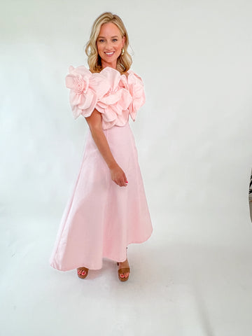 Blush Dress with rosette straps and pleated skirt in a soft pink color