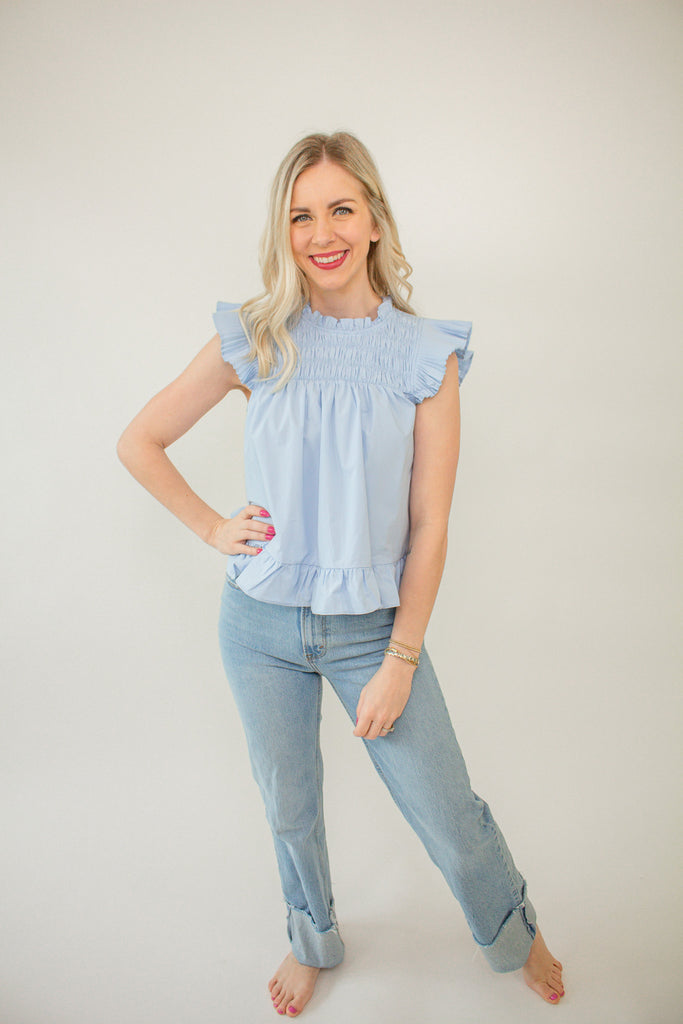 blue_smocked_top_with_pleated_flutter_sleeves_and_ruffle_Details