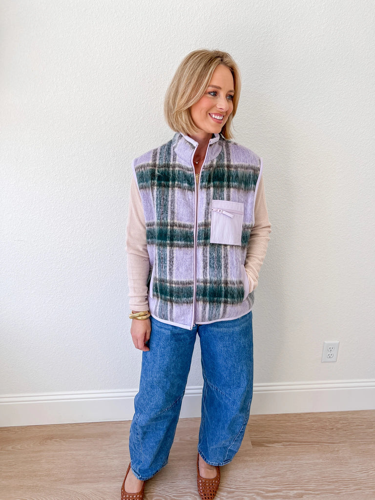 Women’s purple and green plaid fleece vest, available for purchase at an online boutique