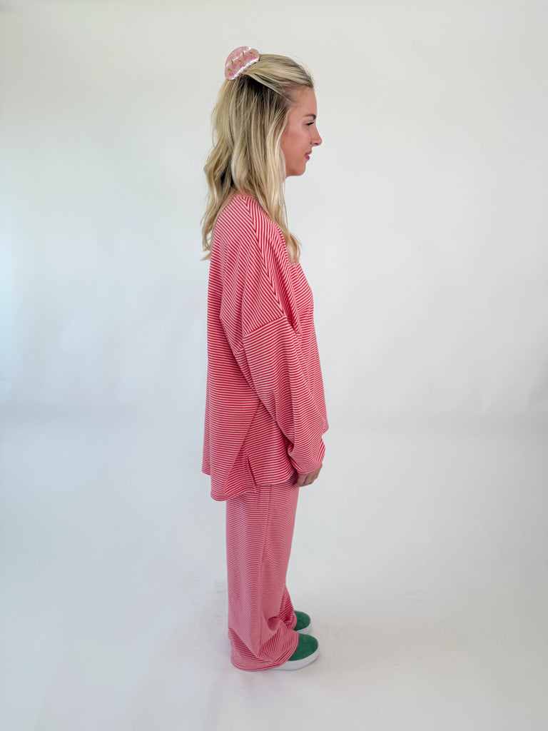 Set in pink and white stripes with an oversized relaxed fit