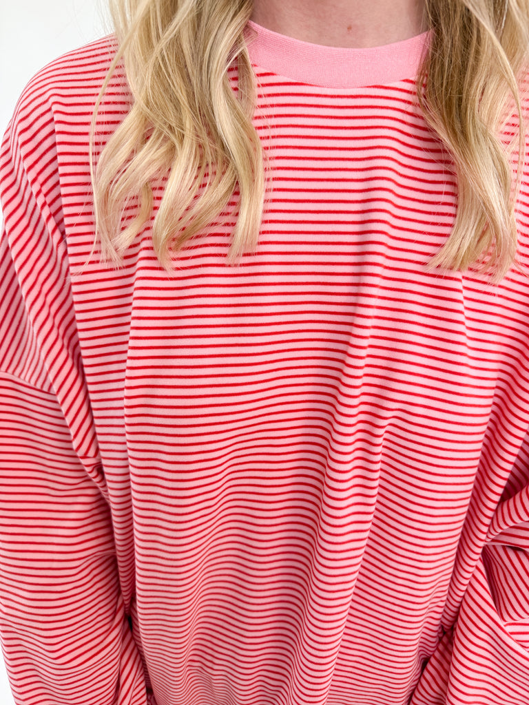 Set in pink and white stripes with an oversized relaxed fit