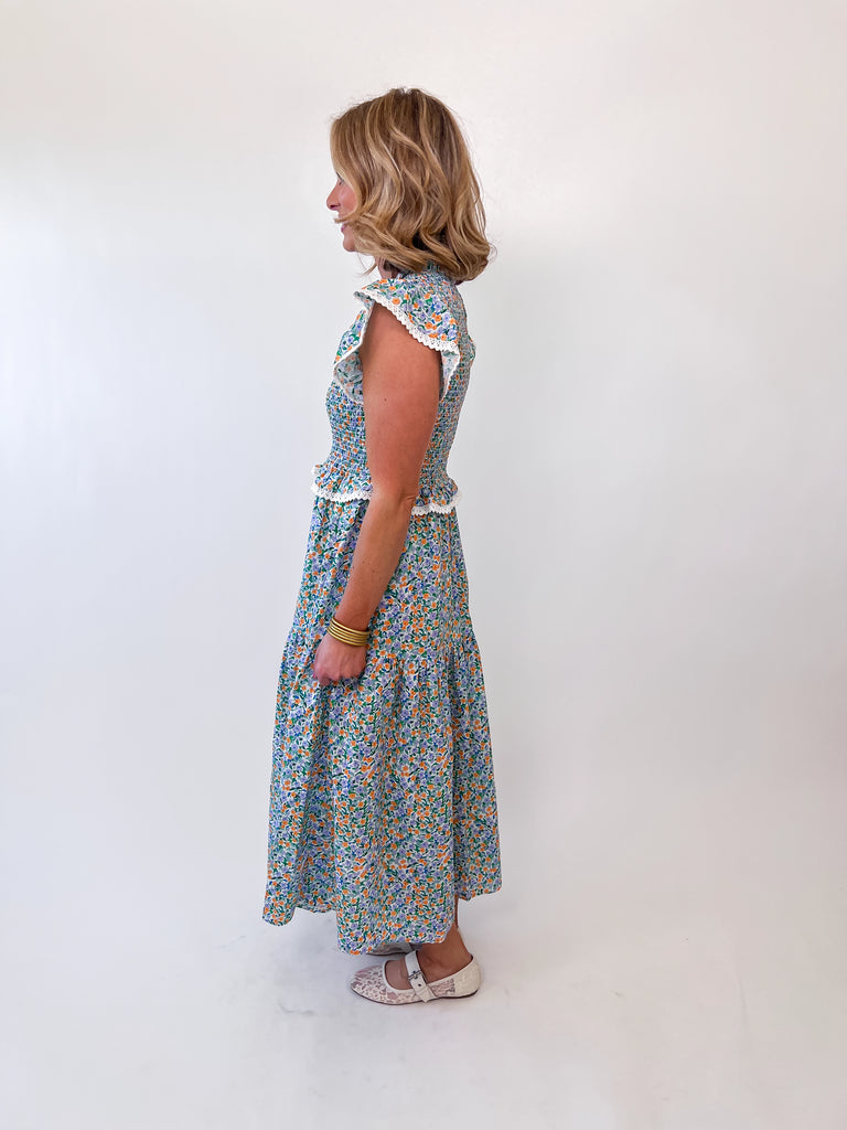 Pastel floral smocked midi dress with flutter sleeves and lace trim