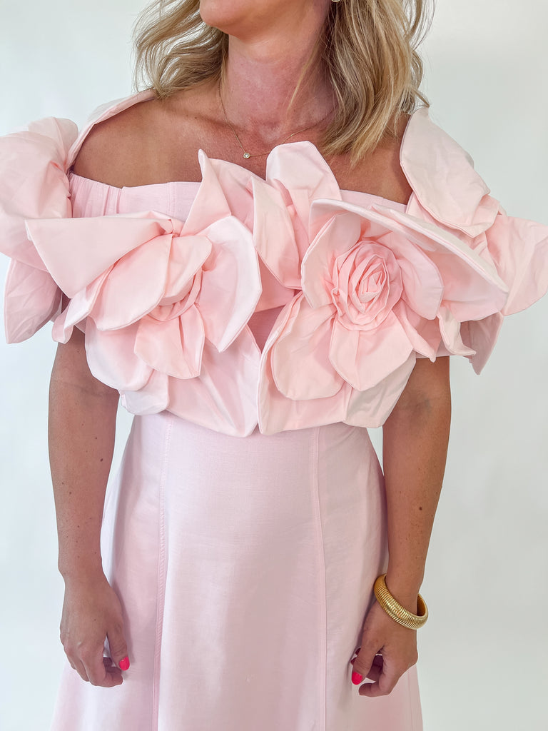 Blush Dress with rosette straps and pleated skirt in a soft pink color