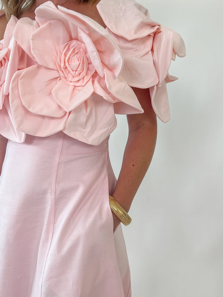 Blush Dress with rosette straps and pleated skirt in a soft pink color