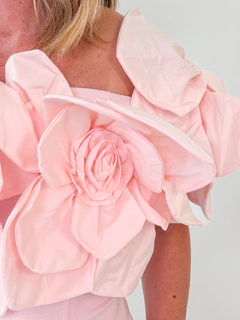 Blush Dress with rosette straps and pleated skirt in a soft pink color