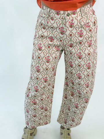 Cream wide-leg pants with rosebud floral embroidery and vintage-inspired pattern