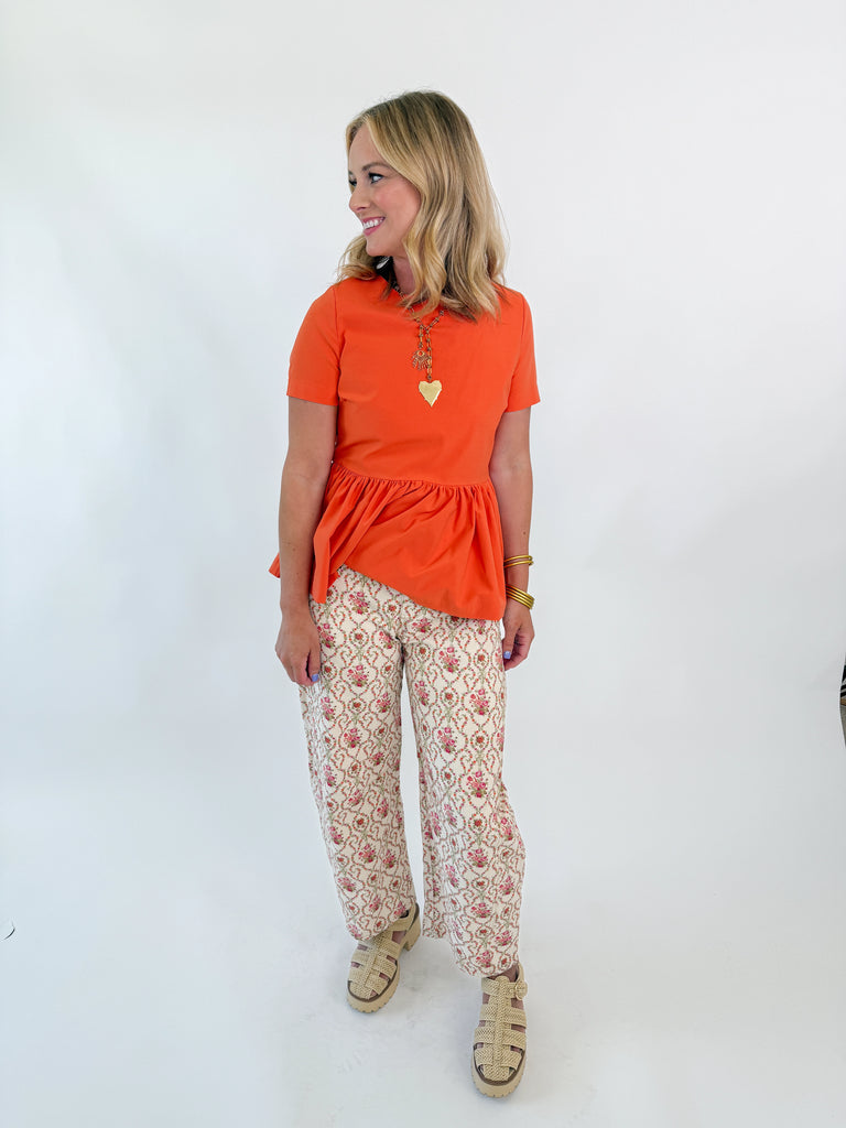 Cream wide-leg pants with rosebud floral embroidery and vintage-inspired pattern