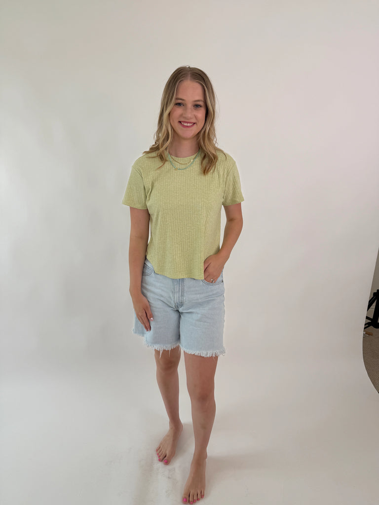 woman wearing short-sleeve ribbed green tee