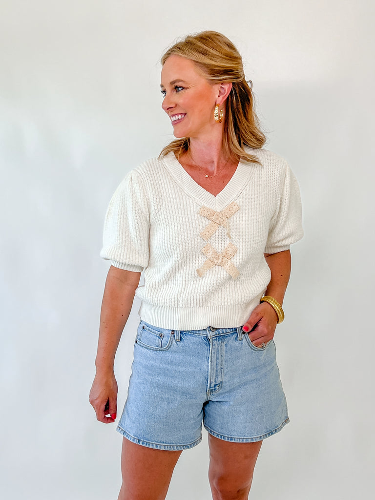 cream puff sleeve knit sweater with lace bow details on front