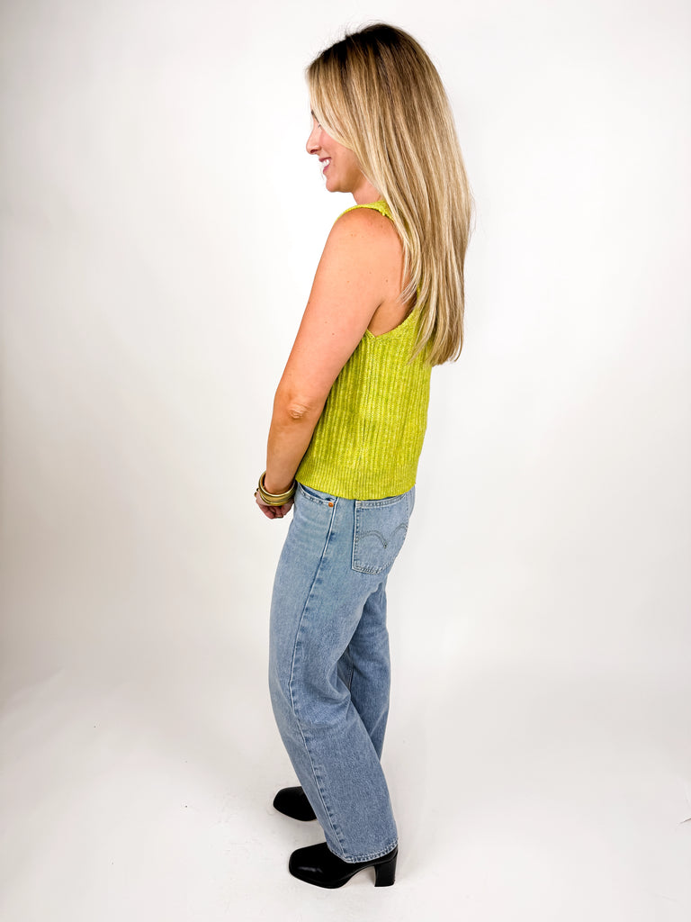 model wearing lime green ribbed knit vest with button front