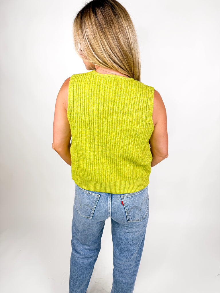 model wearing lime green ribbed knit vest with button front