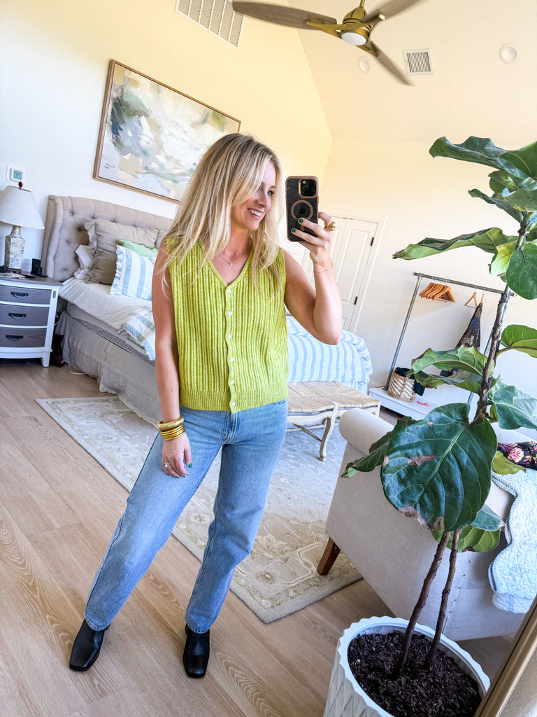 model wearing lime green ribbed knit vest with button front