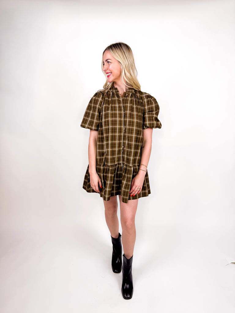model wearing brown plaid mini dress with puff sleeves and button-front detail