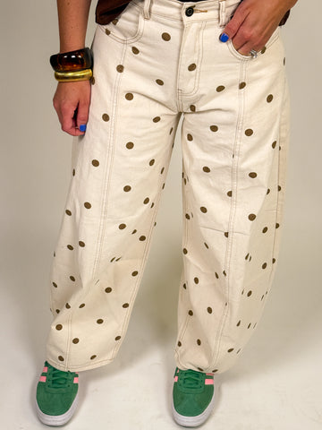 Ivory barrel jeans with allover brown polka dot print styled with a relaxed mid-rise fit