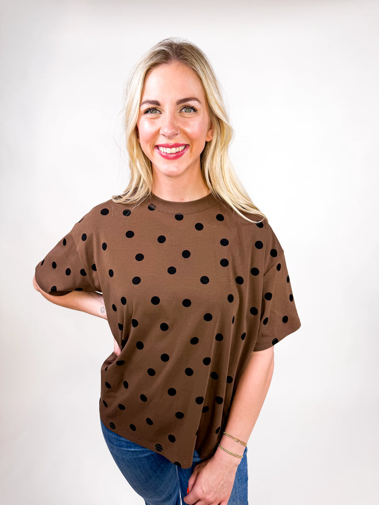model wearing chocolate brown tee with black polka dots