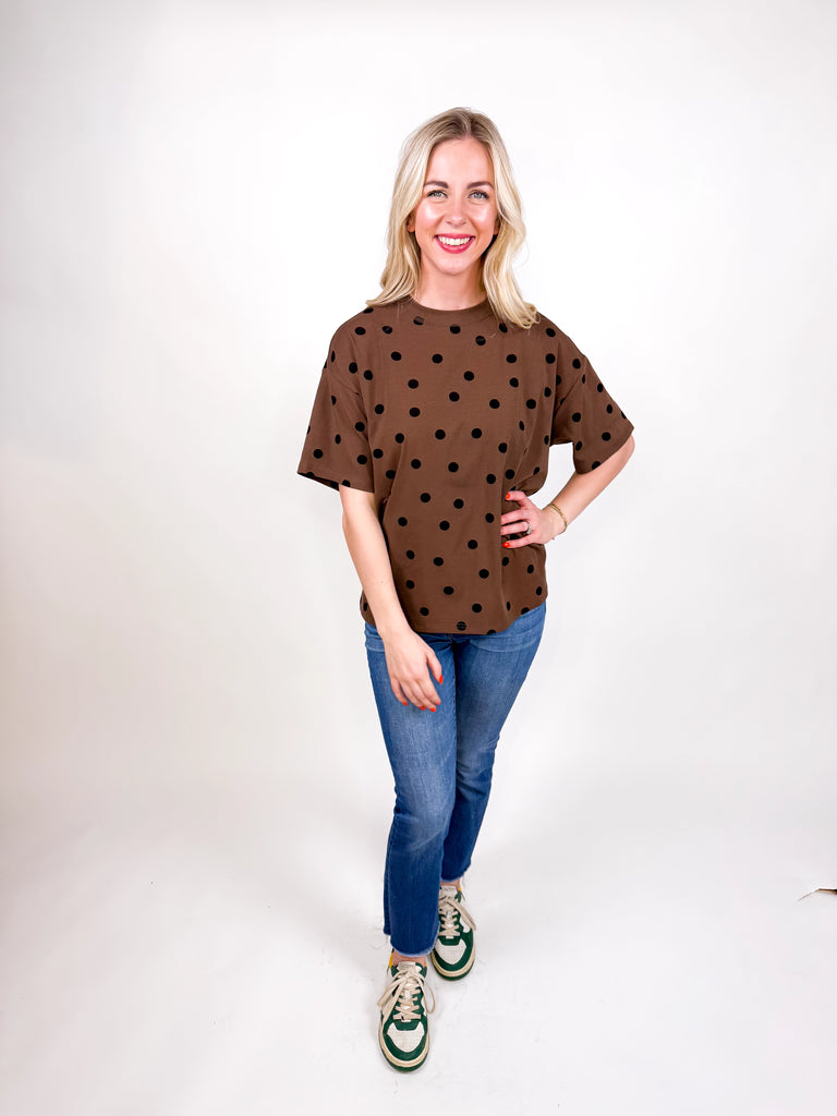 model wearing chocolate brown tee with black polka dots