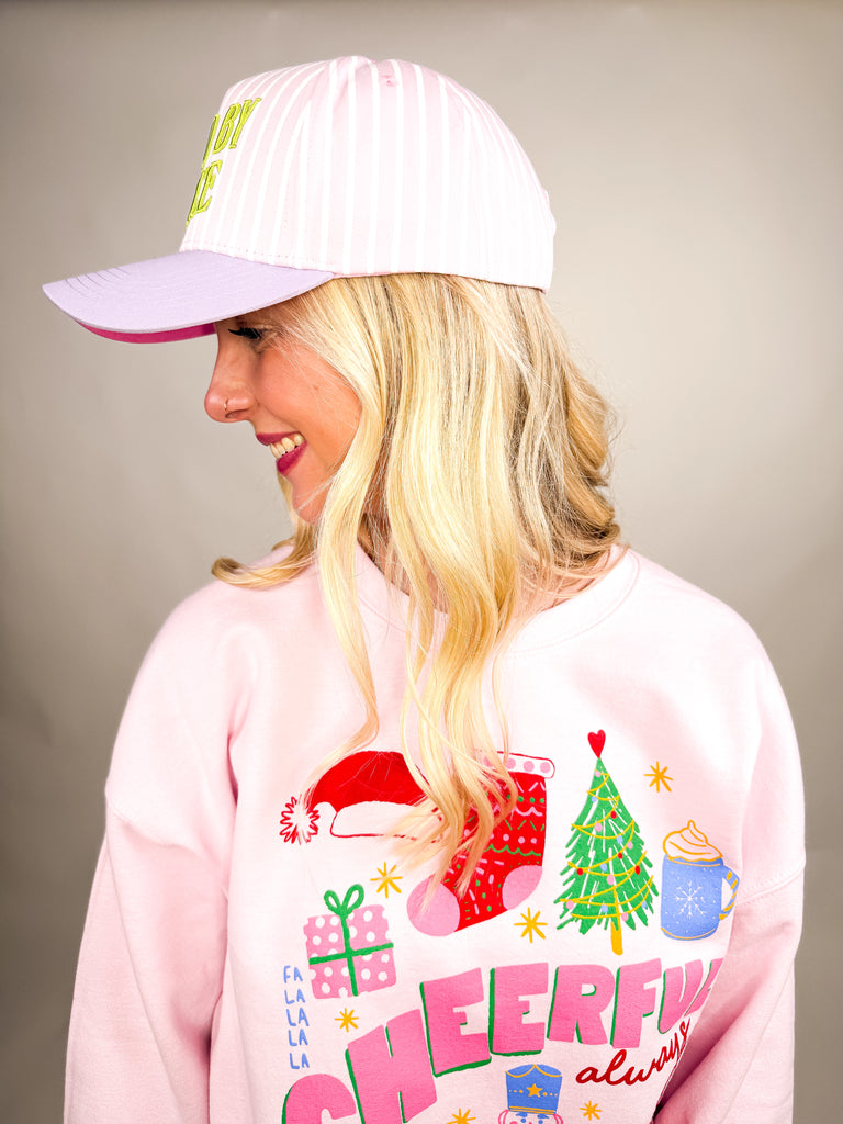 model wearing Saved by Grace Cap with pink and white stripes and lime green embroidered text