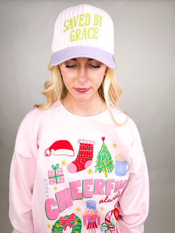 model wearing Saved by Grace Cap with pink and white stripes and lime green embroidered text