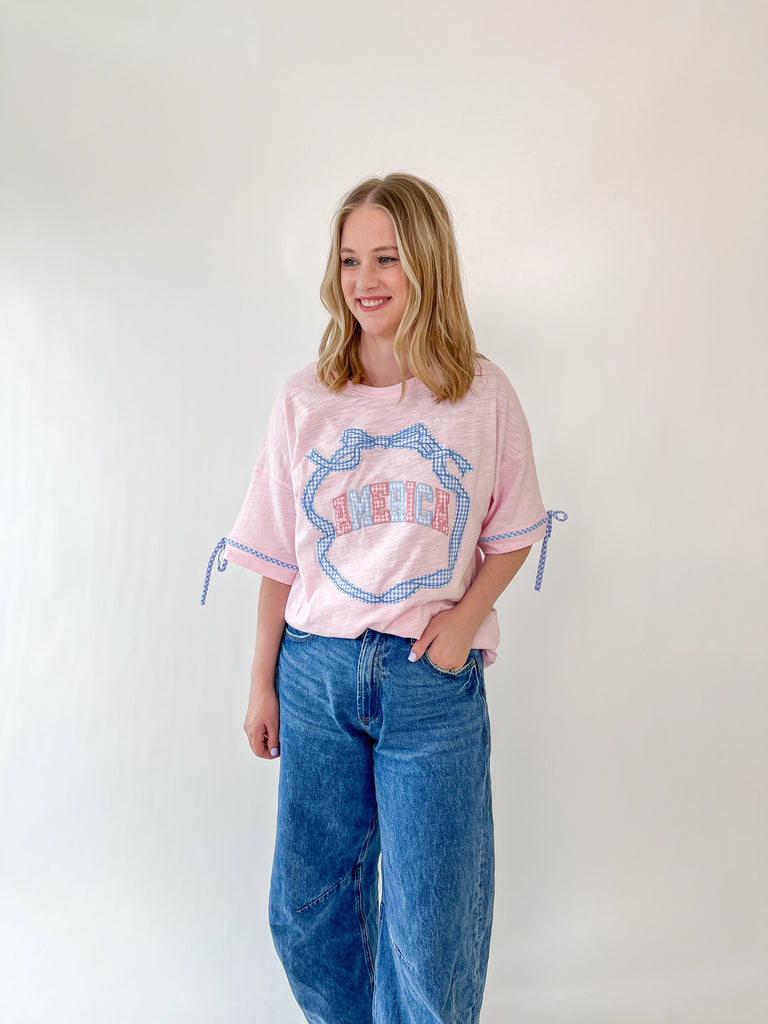 Pink oversized Stars & Bows tee with gingham 'Merica graphic and blue bow