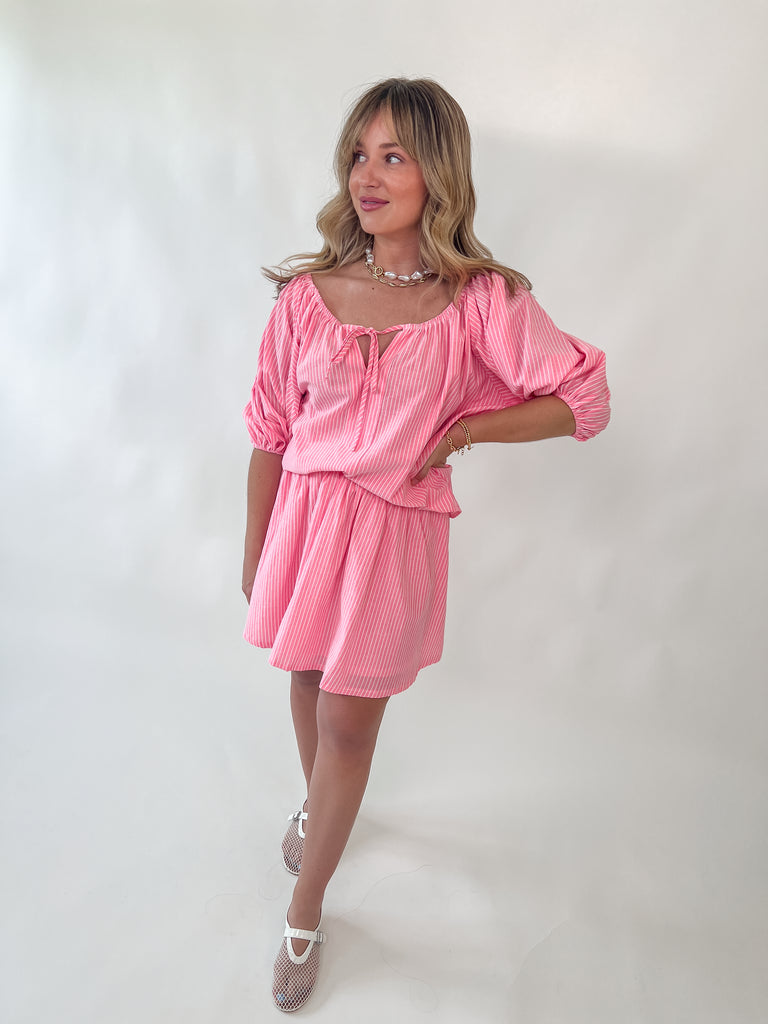 pink off-the-shoulder striped top with front tie detail