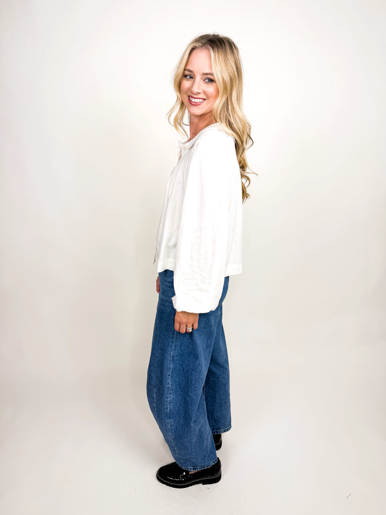 White long sleeve blouse with ruffle collar