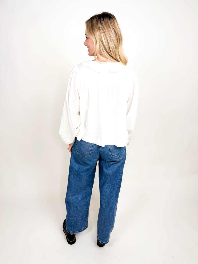 White long sleeve blouse with ruffle collar