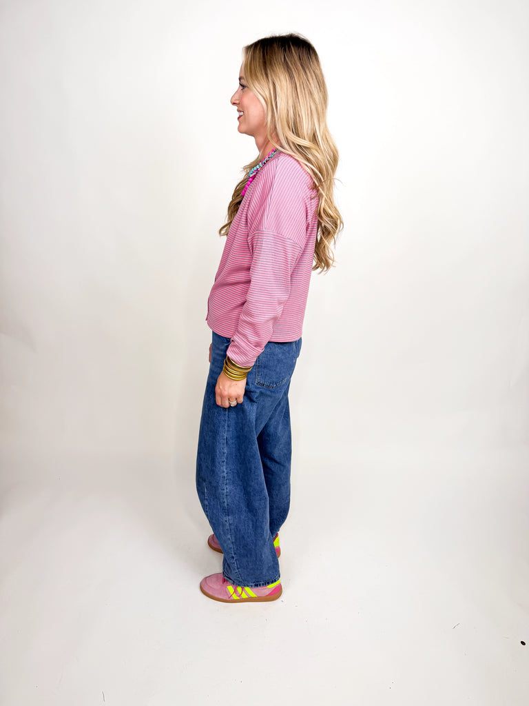 Pink and white striped button-front long sleeve top