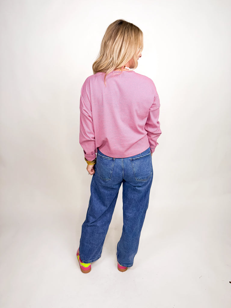 Pink and white striped button-front long sleeve top