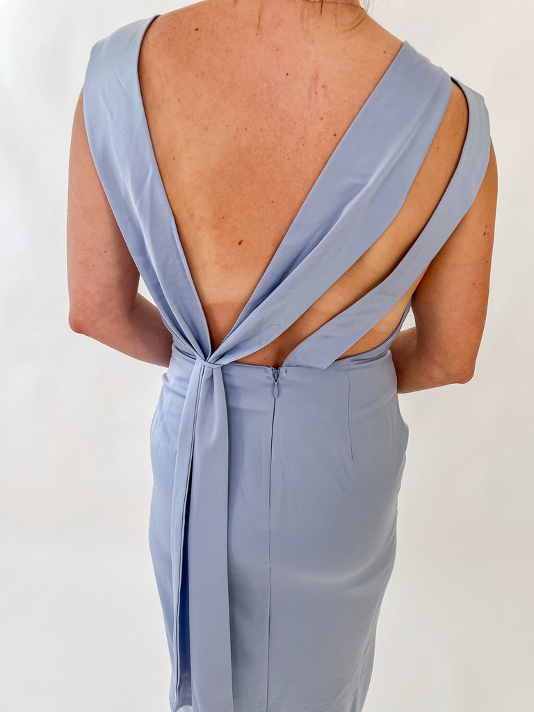 Wisteria satin gown with cowl neckline and draped open back worn by model